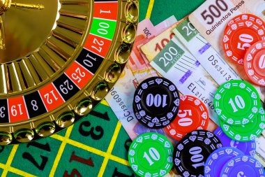 Close-up of betting chips and European Roulette table layout on bowo77